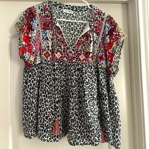 Leopard top with floral embroidery. Loose fitting and flowy.